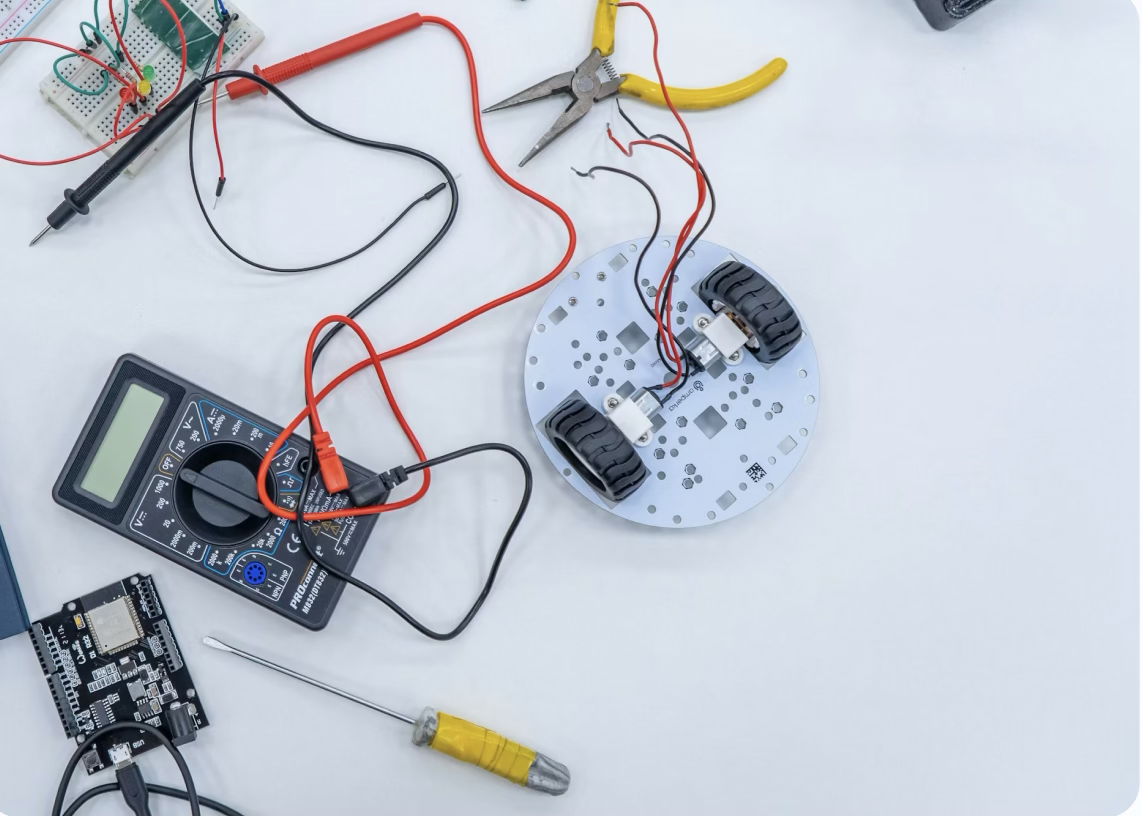 A physical robotics kit with wiring and multiple components